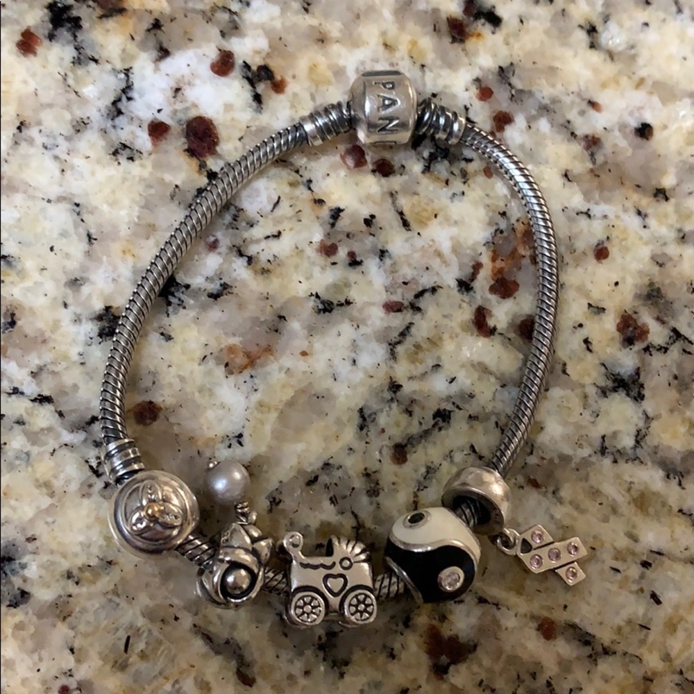 Pandora bracelet with five pandora charms